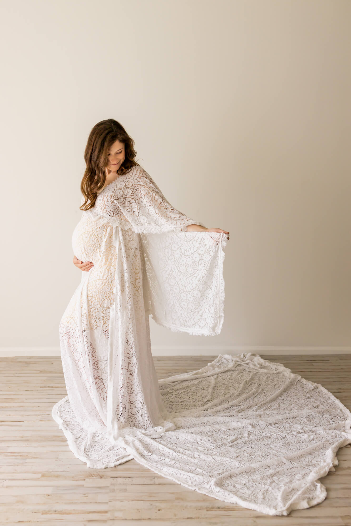 pregnant woman in white lace gown Birmingham Maternity clothes
