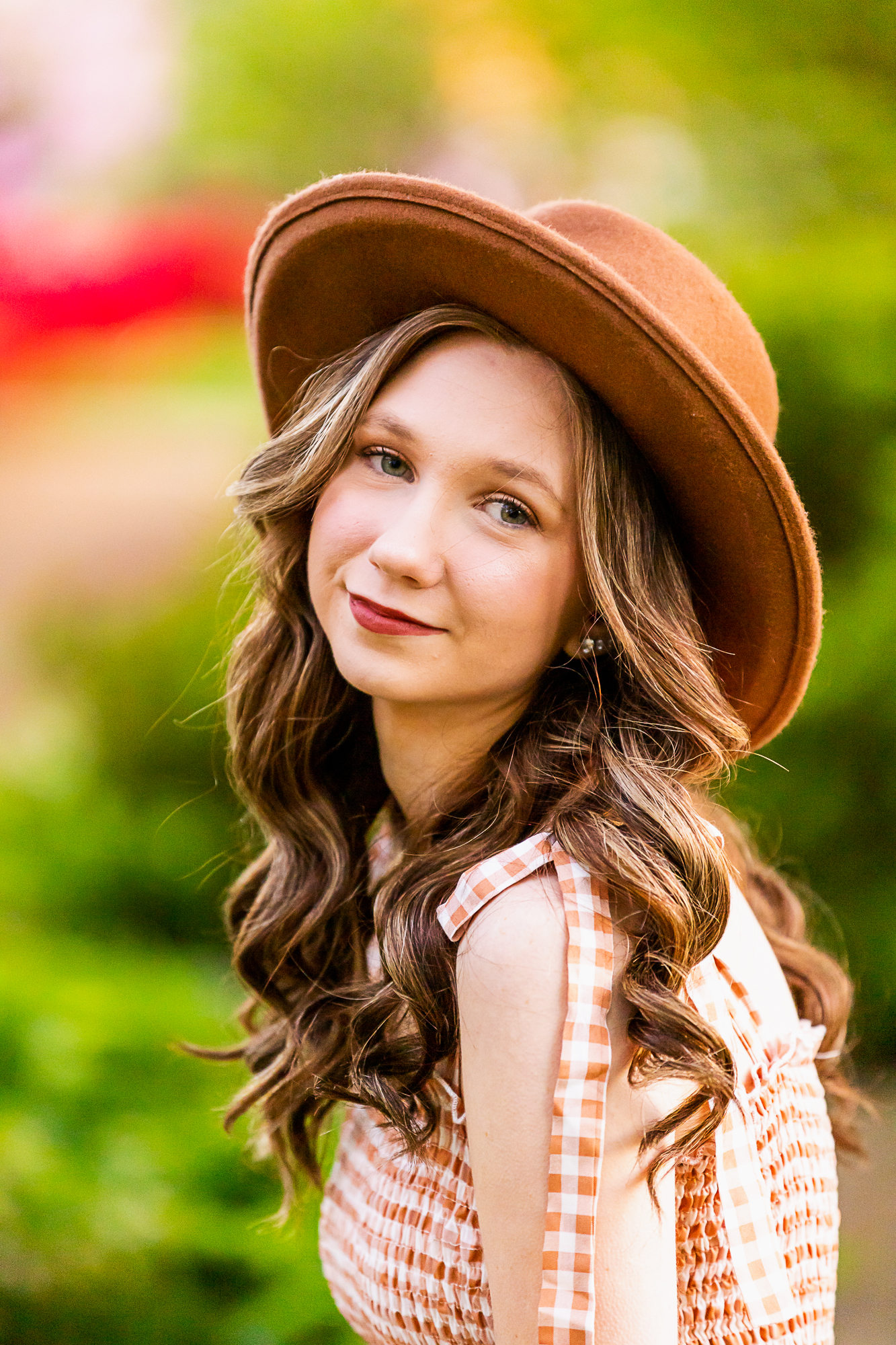 teen girl with long brown curls wearing a brown hat and gingham dress clothing stores birmingham al